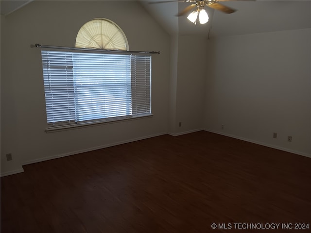 unfurnished room with dark hardwood / wood-style flooring, ceiling fan, and vaulted ceiling