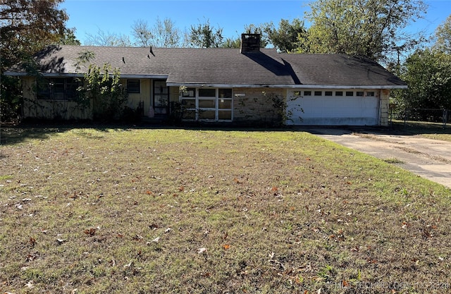 ranch-style house with a front yard and a garage