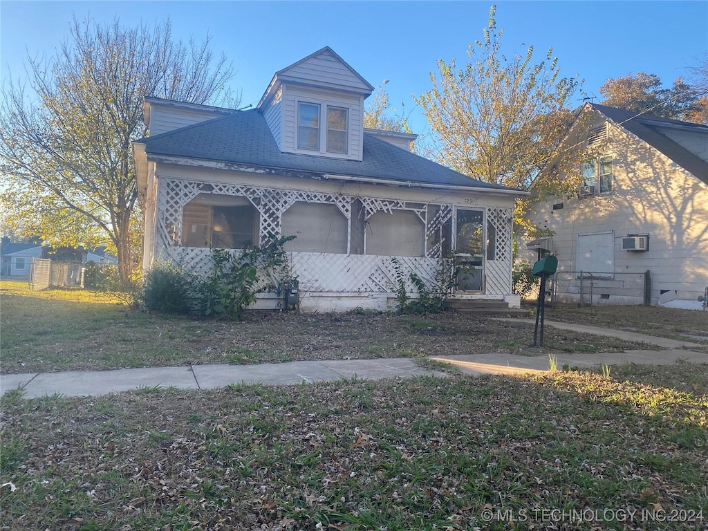 1231 N Creek, Dewey, OK 74029 - view of front of house featuring covered porch and fence