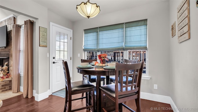 dining room with dark hardwood / wood-style floors