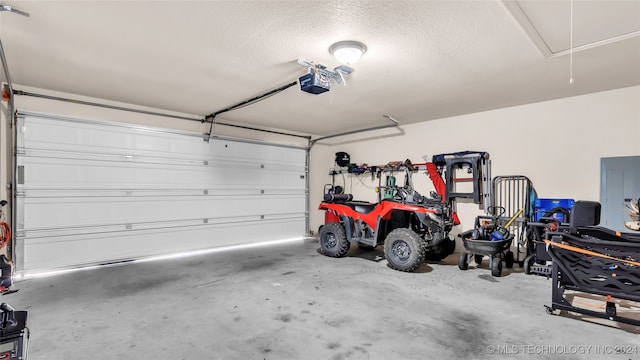 garage featuring a garage door opener