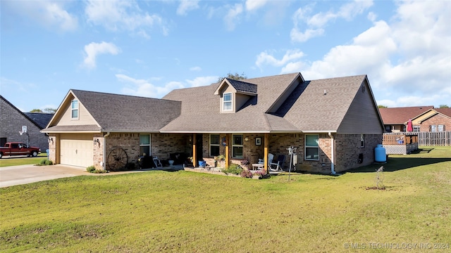 view of front facade with a garage and a front lawn