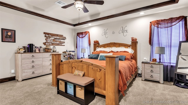 carpeted bedroom with multiple windows and ceiling fan