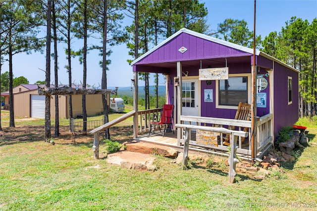 exterior space featuring a lawn and a garage