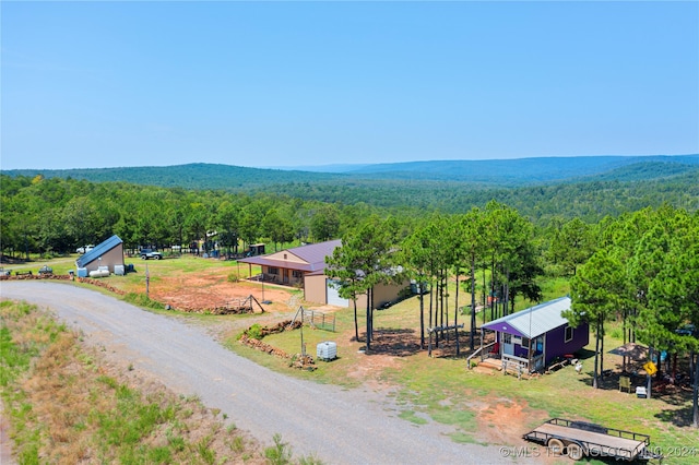 birds eye view of property with a rural view