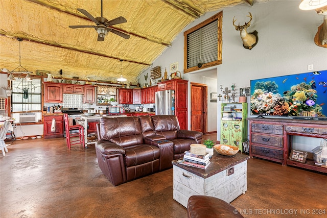 living room featuring ceiling fan and vaulted ceiling