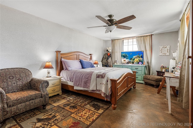 bedroom featuring ceiling fan and a textured ceiling