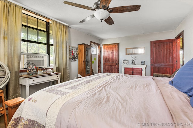 bedroom featuring ceiling fan and cooling unit