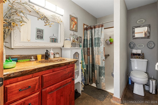 bathroom featuring toilet, a shower with curtain, and vanity