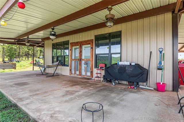 view of patio featuring ceiling fan