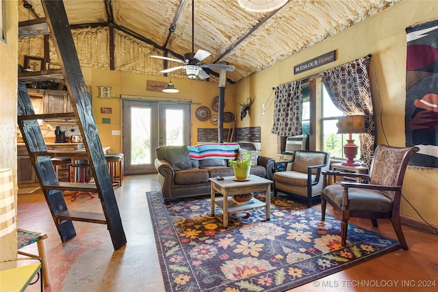 living room with cooling unit, concrete floors, french doors, vaulted ceiling, and ceiling fan