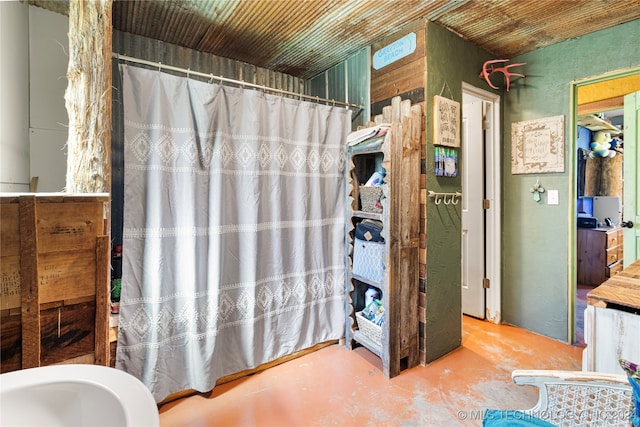 bathroom with concrete flooring