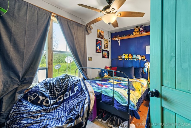 carpeted bedroom with ceiling fan