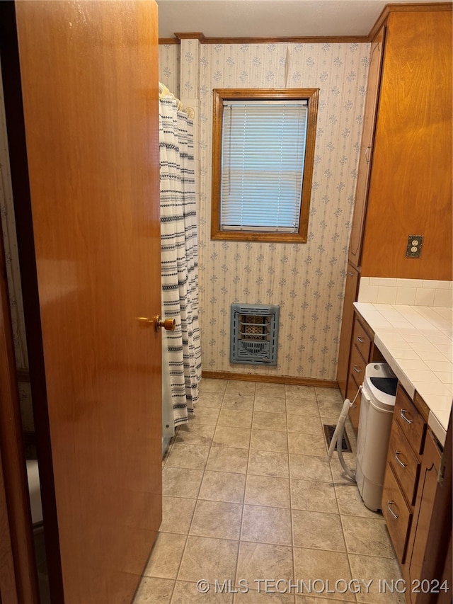 bathroom featuring tile patterned floors and heating unit