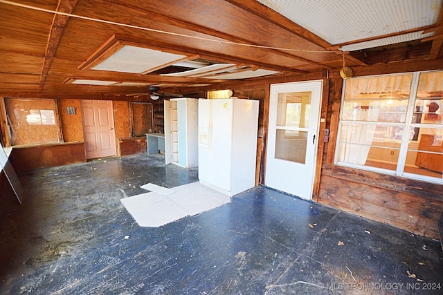 spare room with wooden walls