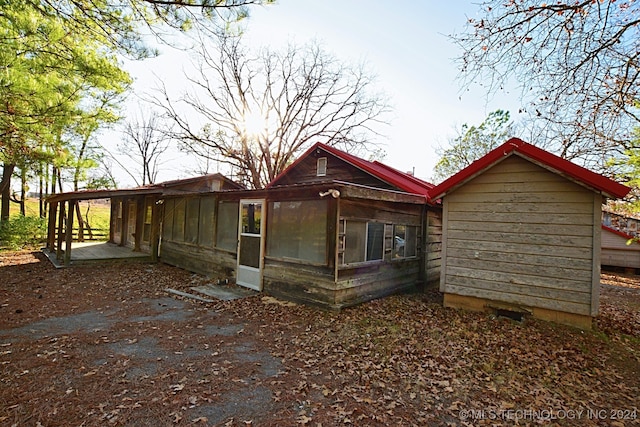 exterior space featuring a sunroom