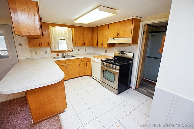 kitchen featuring kitchen peninsula, white appliances, sink, and light tile patterned floors