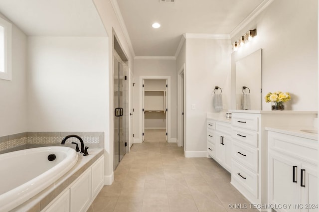 bathroom featuring plus walk in shower, vanity, tile patterned floors, and ornamental molding