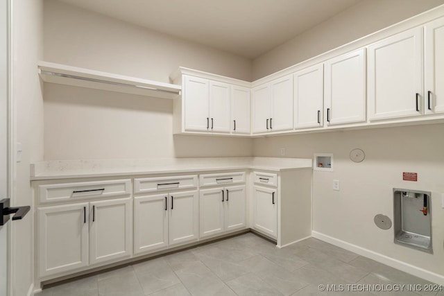 laundry area with cabinets, washer hookup, and gas dryer hookup