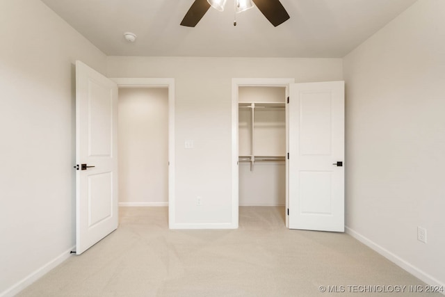 unfurnished bedroom featuring a closet, light carpet, and ceiling fan