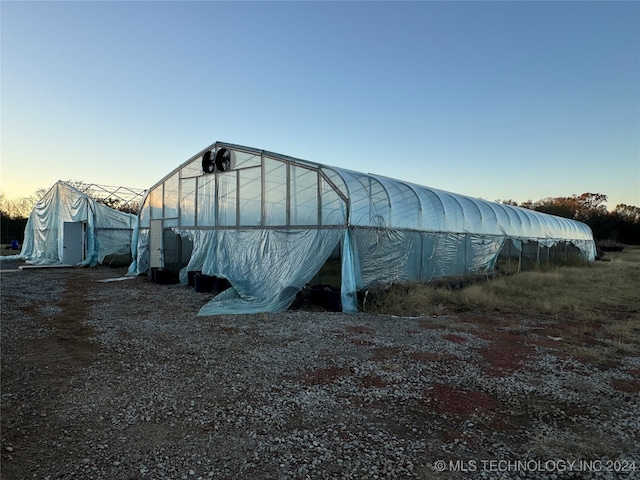 view of outdoor structure at dusk