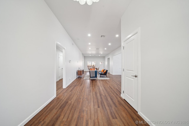 corridor featuring dark hardwood / wood-style floors