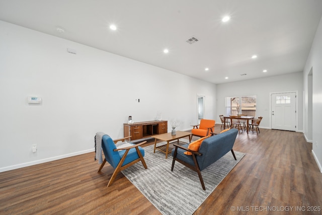 living room with dark hardwood / wood-style floors