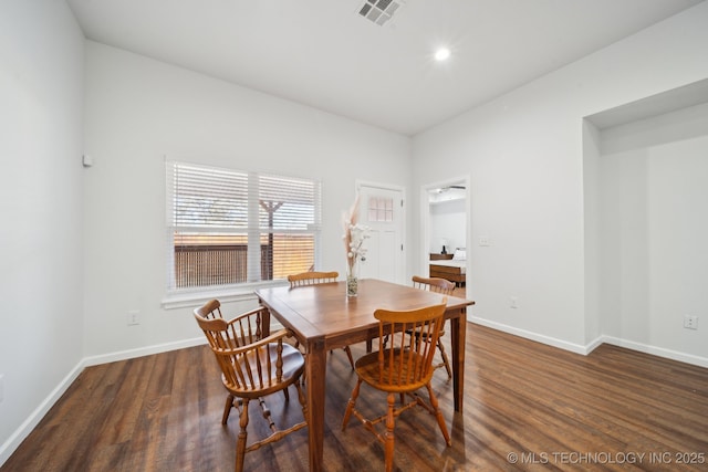 dining room with dark hardwood / wood-style flooring