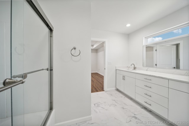 bathroom featuring vanity and shower / bath combination with glass door