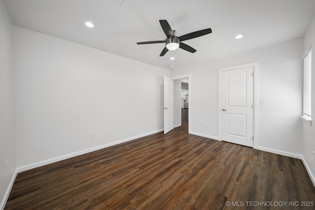 unfurnished bedroom with ceiling fan and dark hardwood / wood-style flooring