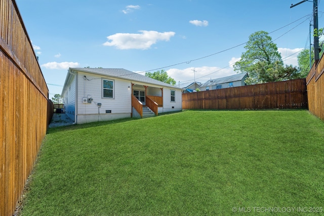 back of house with a yard