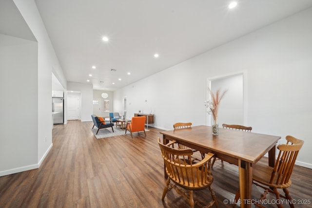 dining space featuring wood-type flooring