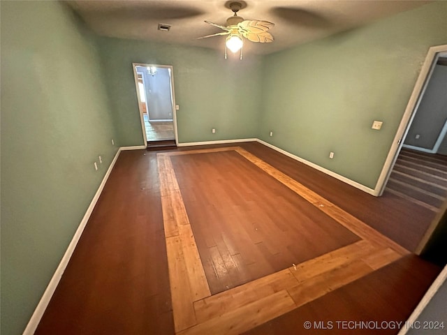 unfurnished room with ceiling fan and wood-type flooring