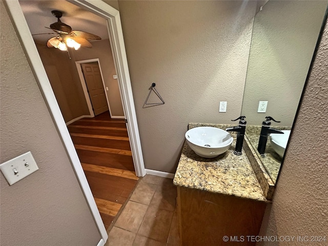 bathroom featuring ceiling fan, tile patterned floors, and vanity