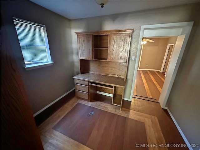 unfurnished office with wood-type flooring