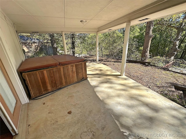 view of patio with a hot tub