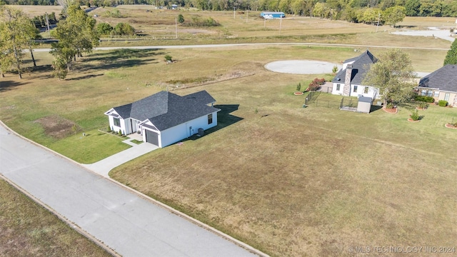 birds eye view of property featuring a rural view