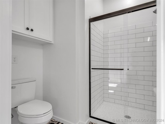 bathroom with toilet and walk in shower