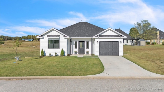 3744 Rosefinch, Grove, OK 74344 - modern farmhouse style home featuring board and batten siding, an attached garage, driveway, a front lawn, and roof with shingles