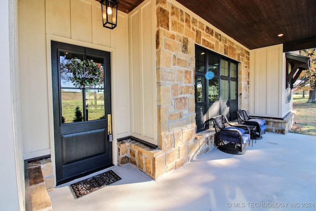 doorway to property featuring a porch