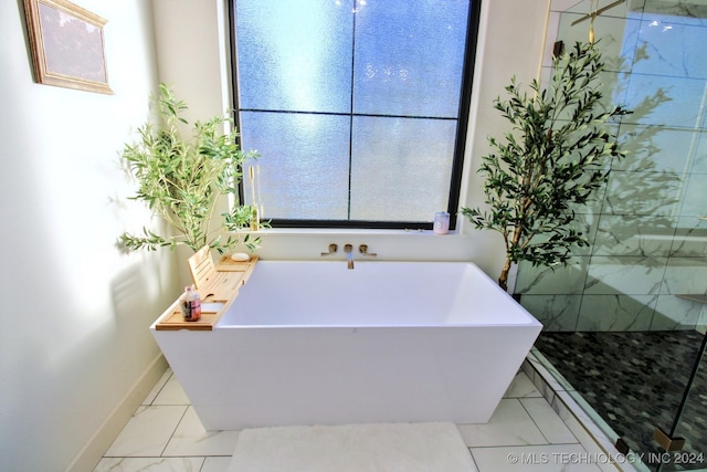 bathroom featuring a tub to relax in