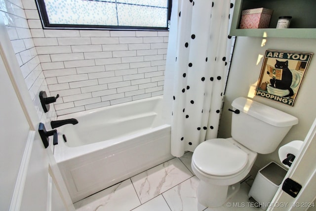 bathroom with shower / tub combo and toilet