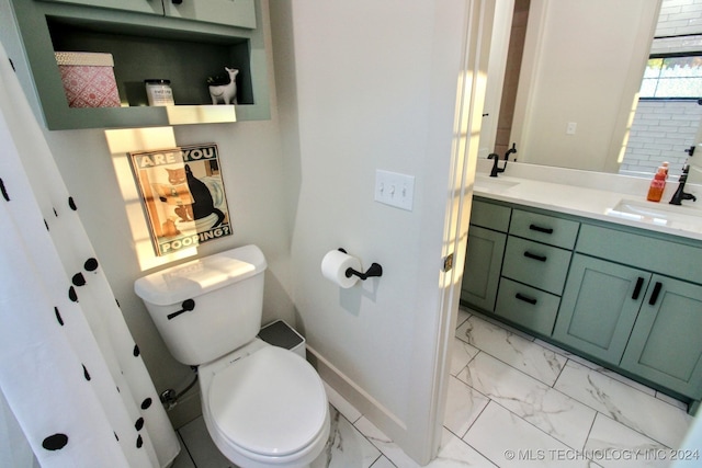 bathroom featuring vanity and toilet