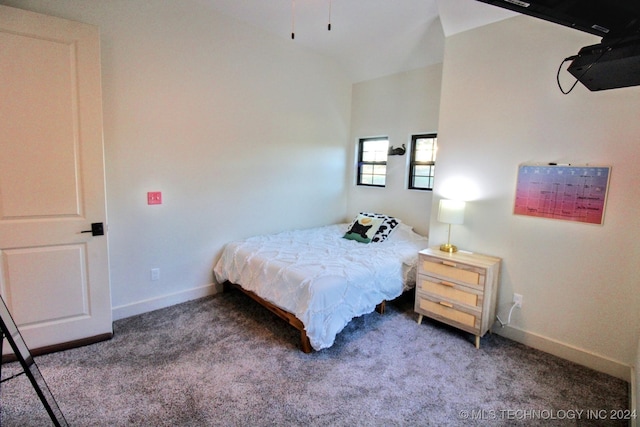 carpeted bedroom featuring vaulted ceiling