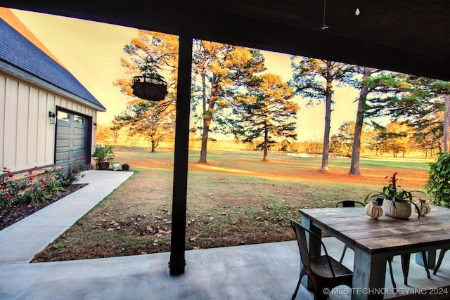 yard at dusk with a garage