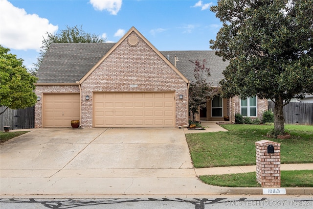 view of front facade with a garage and a front yard