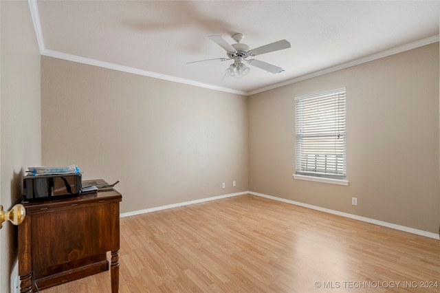 spare room featuring ceiling fan, wood-type flooring, and ornamental molding