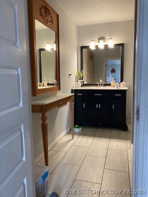 bathroom with vanity and tile patterned floors