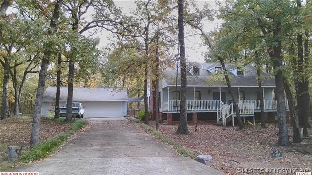 view of front of house with a garage and covered porch