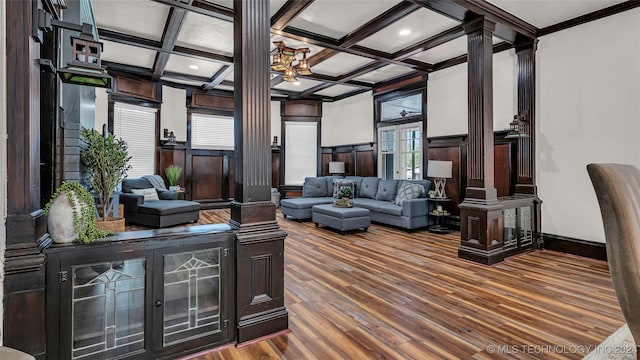 living room with coffered ceiling, hardwood / wood-style floors, ornate columns, and plenty of natural light